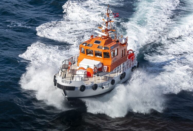 A beautiful shot of a pilot boat in motion on a sunny day in Norway